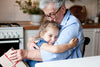 DeepMarine Collagen - Young Girl Giving a Gift to Her Grandmother