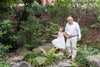 DeepMarine Collagen - Elderly man walking in a garden with his granddaughter