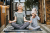 lady and daughter doing yoga