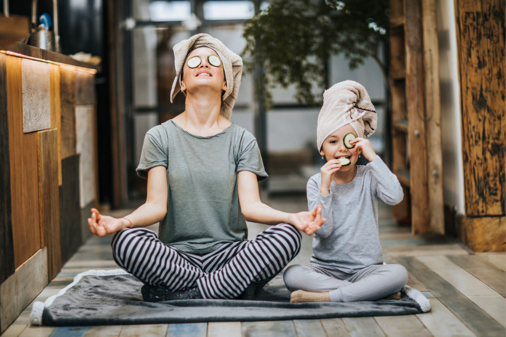 lady and daughter doing yoga