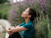 woman outside with eyes closed